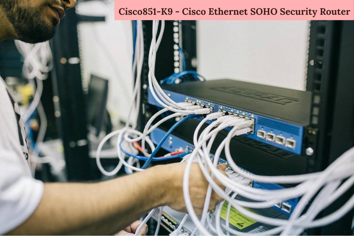 Technician setting up Cisco851-K9 - Cisco Ethernet SOHO Security Router with multiple network cables