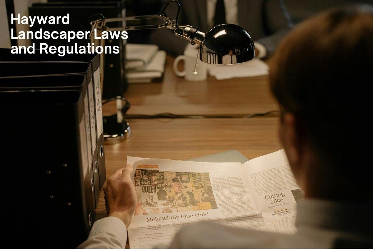 Person reading documents at a desk with text overlay 'Hayward Landscaper Laws and Regulations'