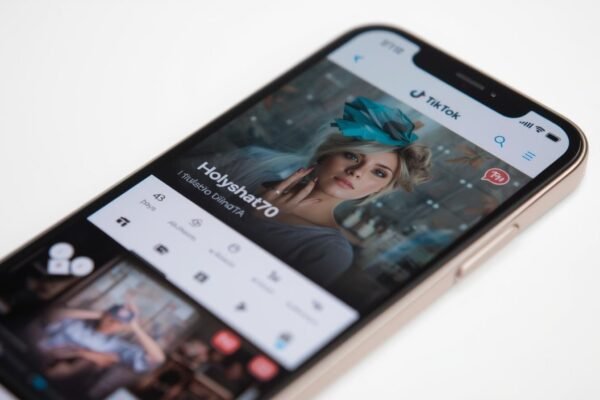 Holyshat70 TikTok Drama Everyone’s Talking About Creates Chaos Smartphone screen showing Holyshat70 TikTok profile with creative content.