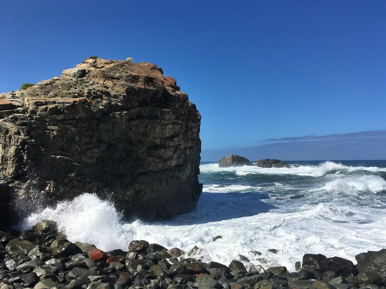 Stay in lodges by the beach with stunning ocean views and rocky cliffs