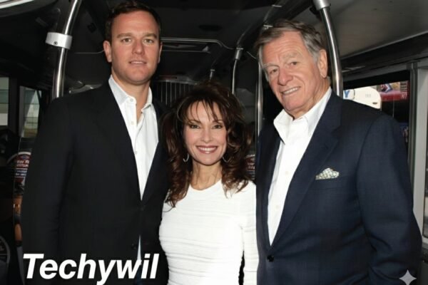 Andreas Huber with his parents Susan Lucci and Helmut Huber smiling together at an event.