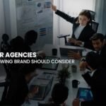 8 Best PR Agencies: A professional team collaborating during a strategy session to help growing brands succeed in 2026