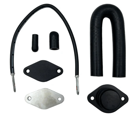 Components of a Duramax Delete Kit, including hoses, plates, and fittings designed to bypass emissions systems for improved performance
