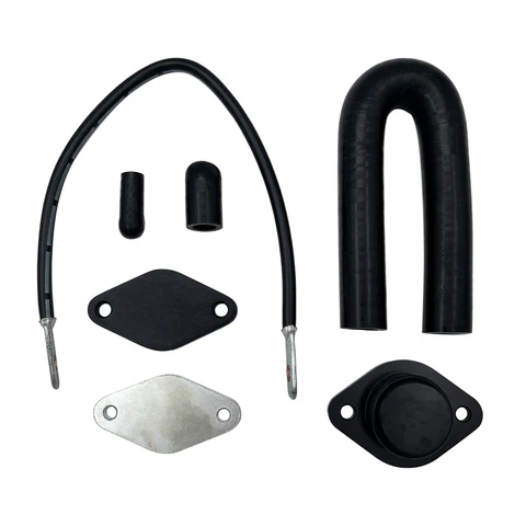 Components of a Duramax Delete Kit, including hoses, plates, and fittings designed to bypass emissions systems for improved performance