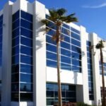 A modern commercial building with large windows and clean architectural design, showcasing the impact of commercial architectural design on business spaces.