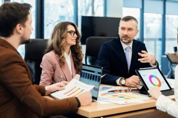 Team discussing effective marketing strategies for bariatric surgeons, focusing on data and patient outreach in a professional meeting