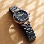 Elegant GC watch with a black and rose gold design, showcasing the stylish bracelet and detailed dial