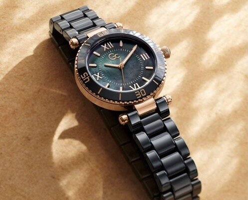 Elegant GC watch with a black and rose gold design, showcasing the stylish bracelet and detailed dial