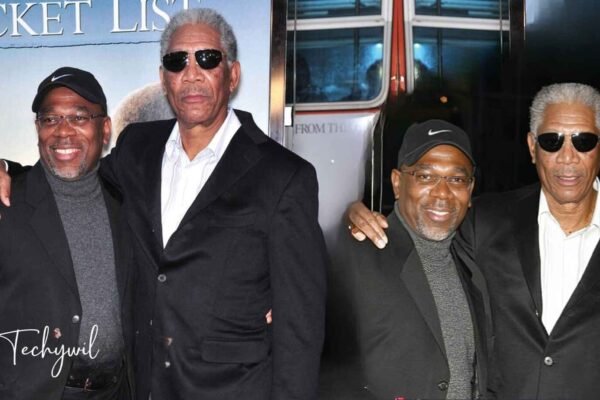 Saifoulaye Freeman with his father Morgan Freeman at a public event, both dressed in black suits and sunglasses