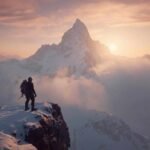 Climber stands at the peak of a snowy mountain during sunset, reflecting the challenges explored in the SEO optimization Arbicolix Mountain game review