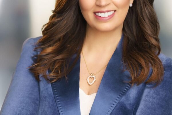 Elizabeth Fraley, expert in school readiness, offering valuable Tips for Starting A New School with a confident smile, ready to guide children through transitions.