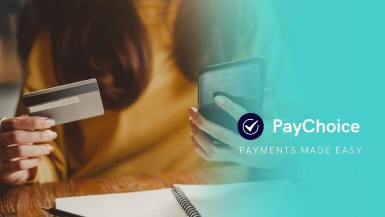 A person holding a credit card and smartphone, using PayChoice for seamless direct debit payments.