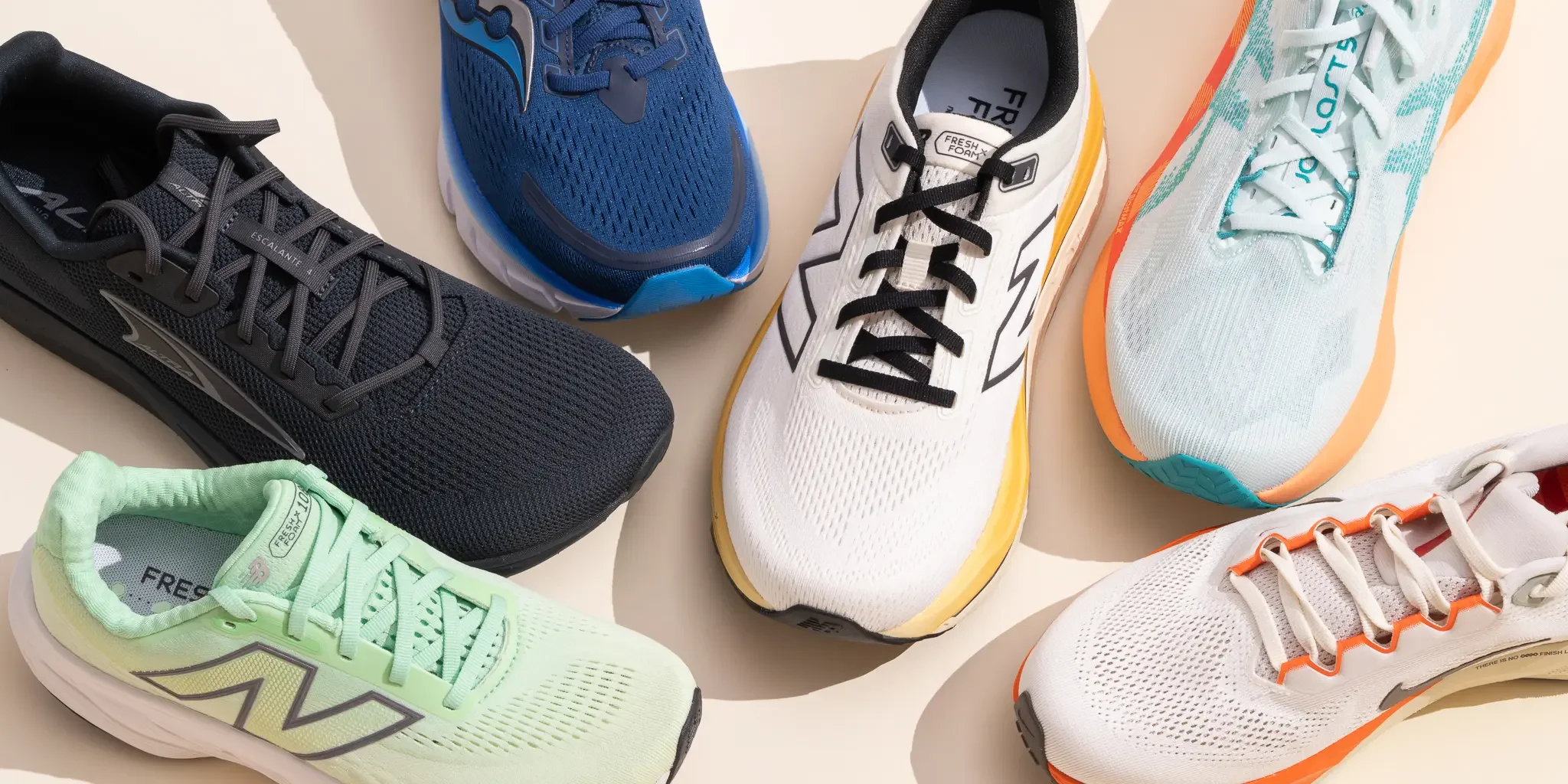 A variety of running shoes displayed together, showcasing different colors and styles for optimal comfort and support in running