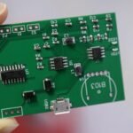FastTurn PCB circuit board prototype with electronic components showcasing precision assembly and modern PCB manufacturing technology